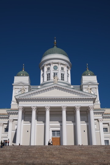 Helsinki Cathedral neoclassical façade and green dome against deep blue sky