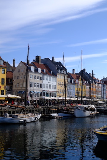 Nyhavn, Copenhagen—colorful townhouses, boats, and canal on a bright day